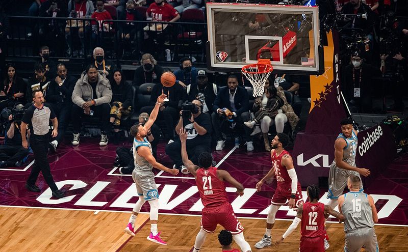 A player rises toward the basket