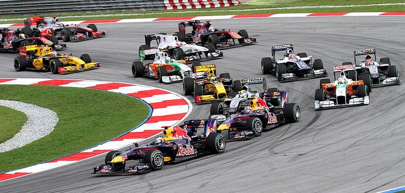 The pack funnels into the first corners of a Grand Prix