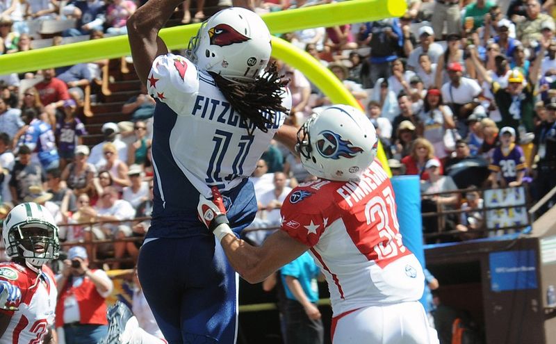 A receiver catches a touchdown pass